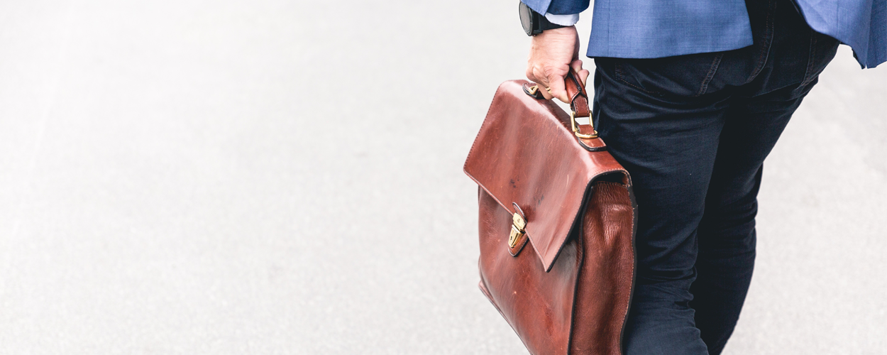 Business woman holding a brief case