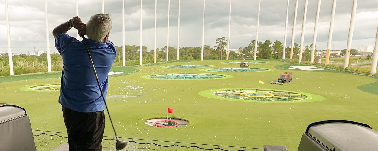 elderly person playing golf for mental and physical health benefits